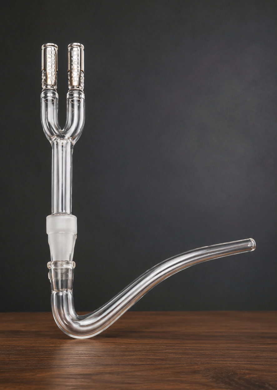 A clear glass J-hook setup with a dual-port Claisen adapter, showing how two identical dry herb vaporizers can connect to a single glass piece.